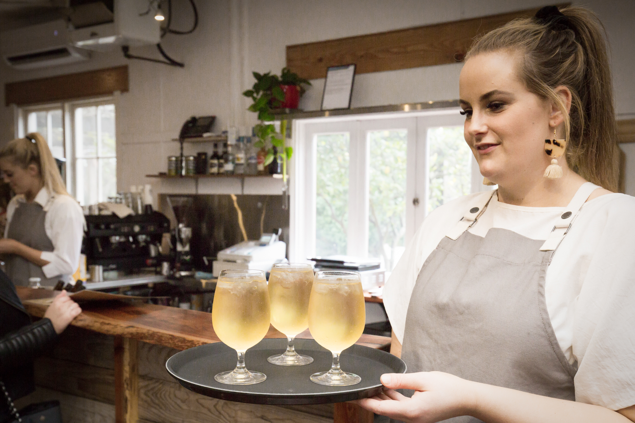 Waitress serving cider